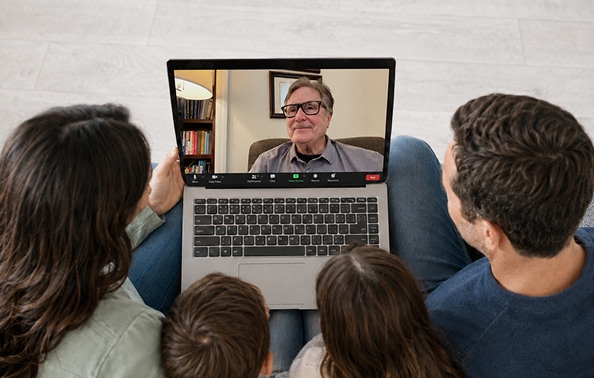 a couple and their two children speaking with dr. nay over a zoom session a couple and their two children speaking with dr. nay over a zoom session